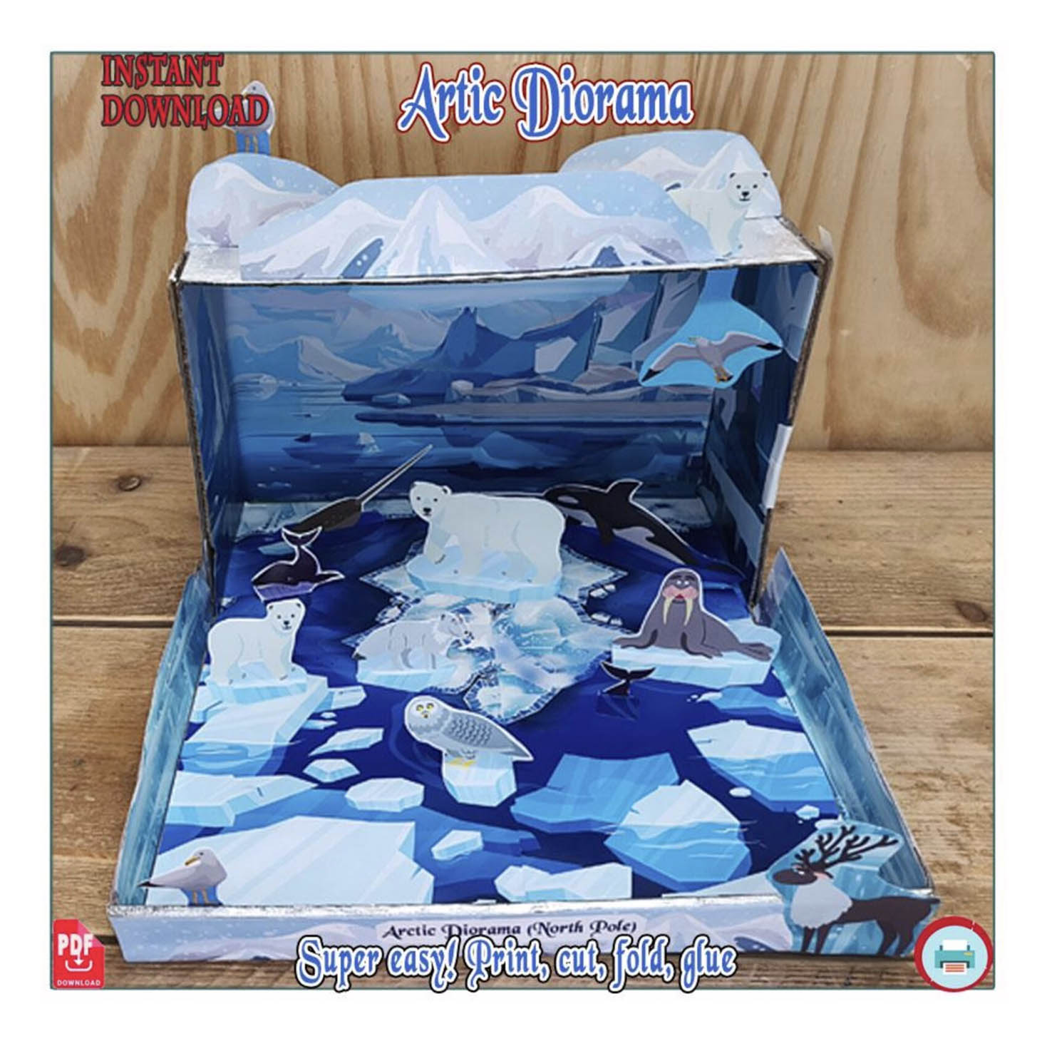 Completed polar habitat diorama school project with Arctic animals, ice and icy scenery