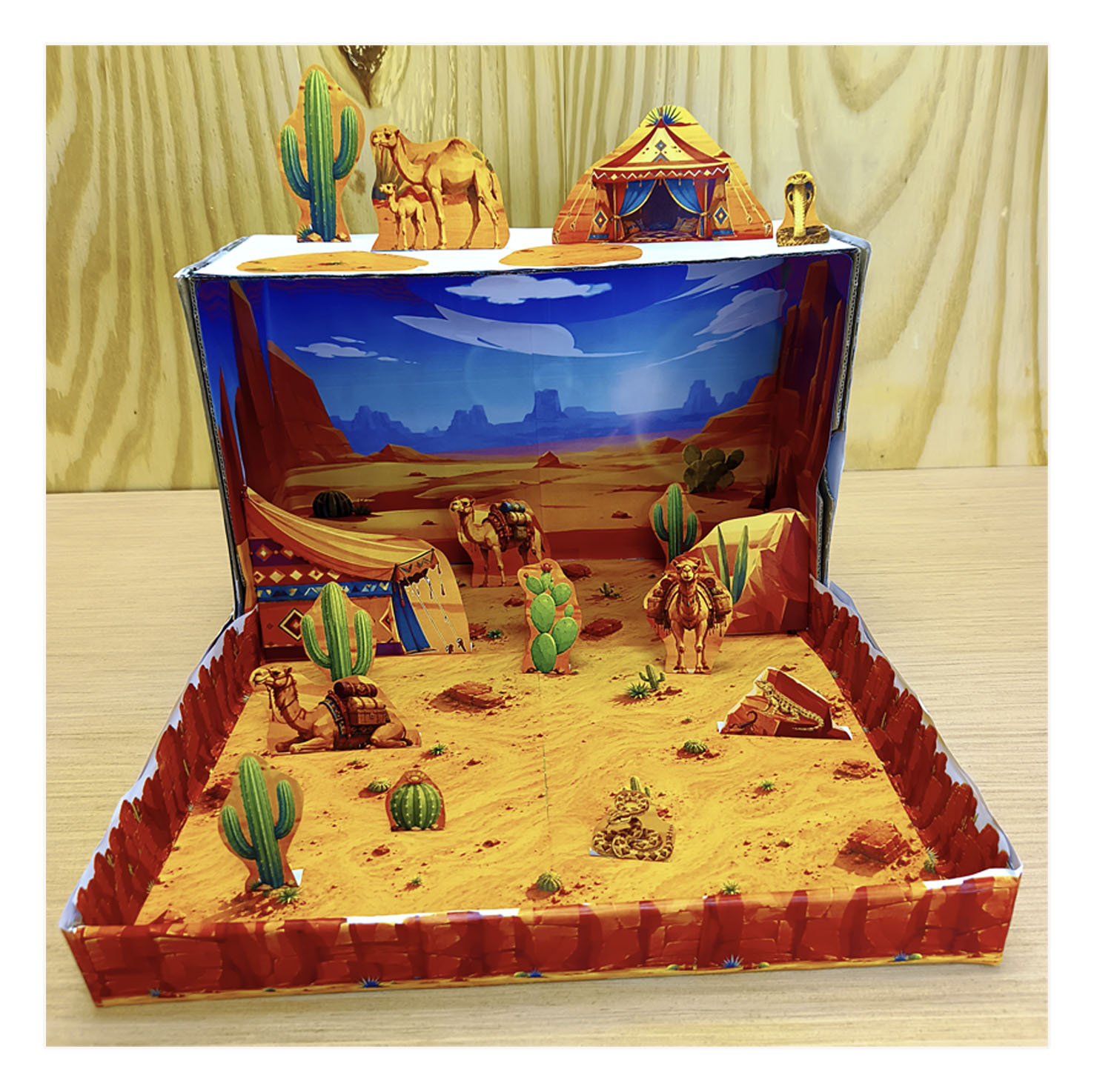Completed desert habitat diorama with camels, cacti, desert tent, rocky scenery and sandy landscape