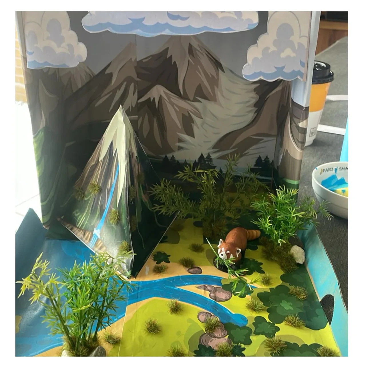 Student Water Cycle Project customized with plants and an animal figure