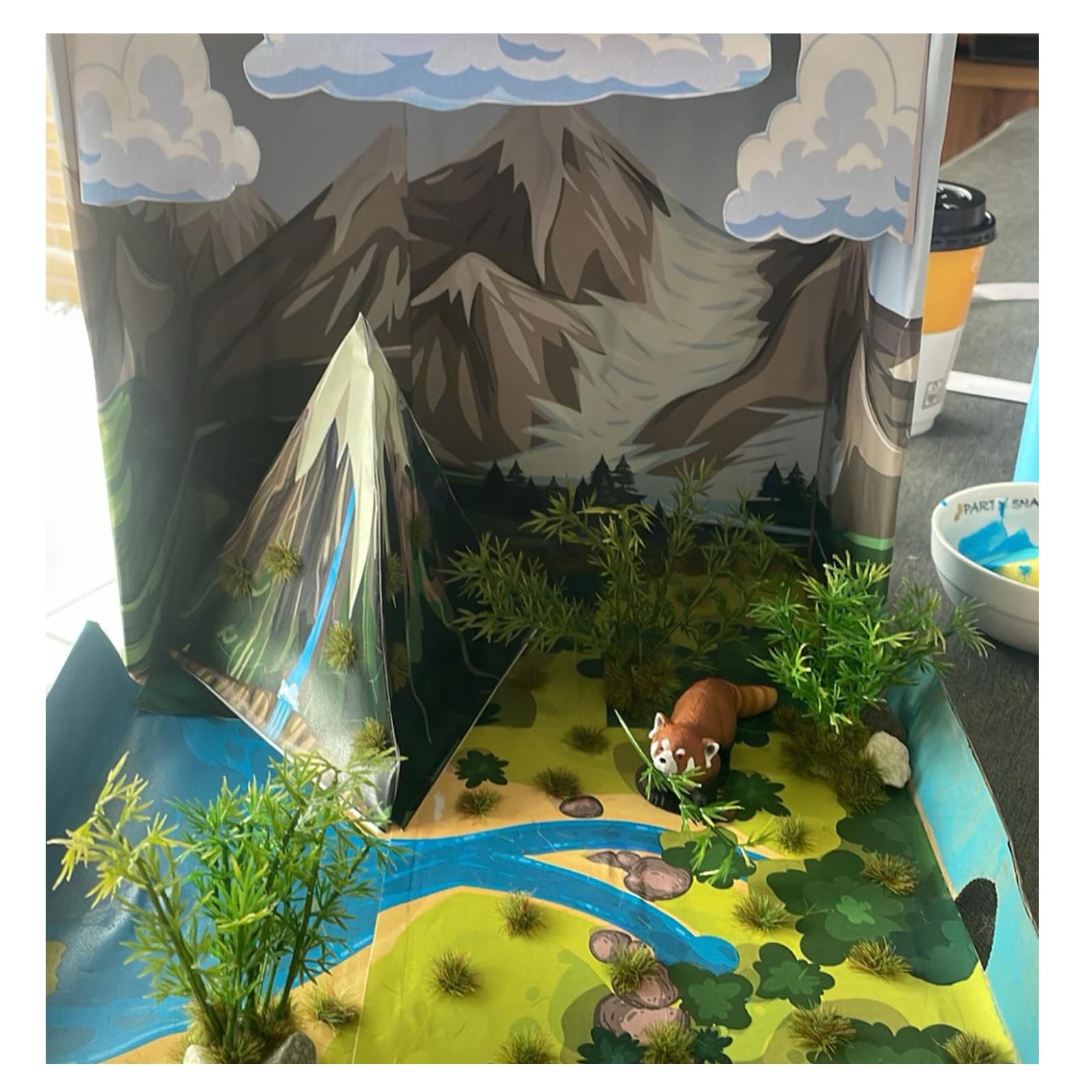 Student Water Cycle Project customized with plants and an animal figure